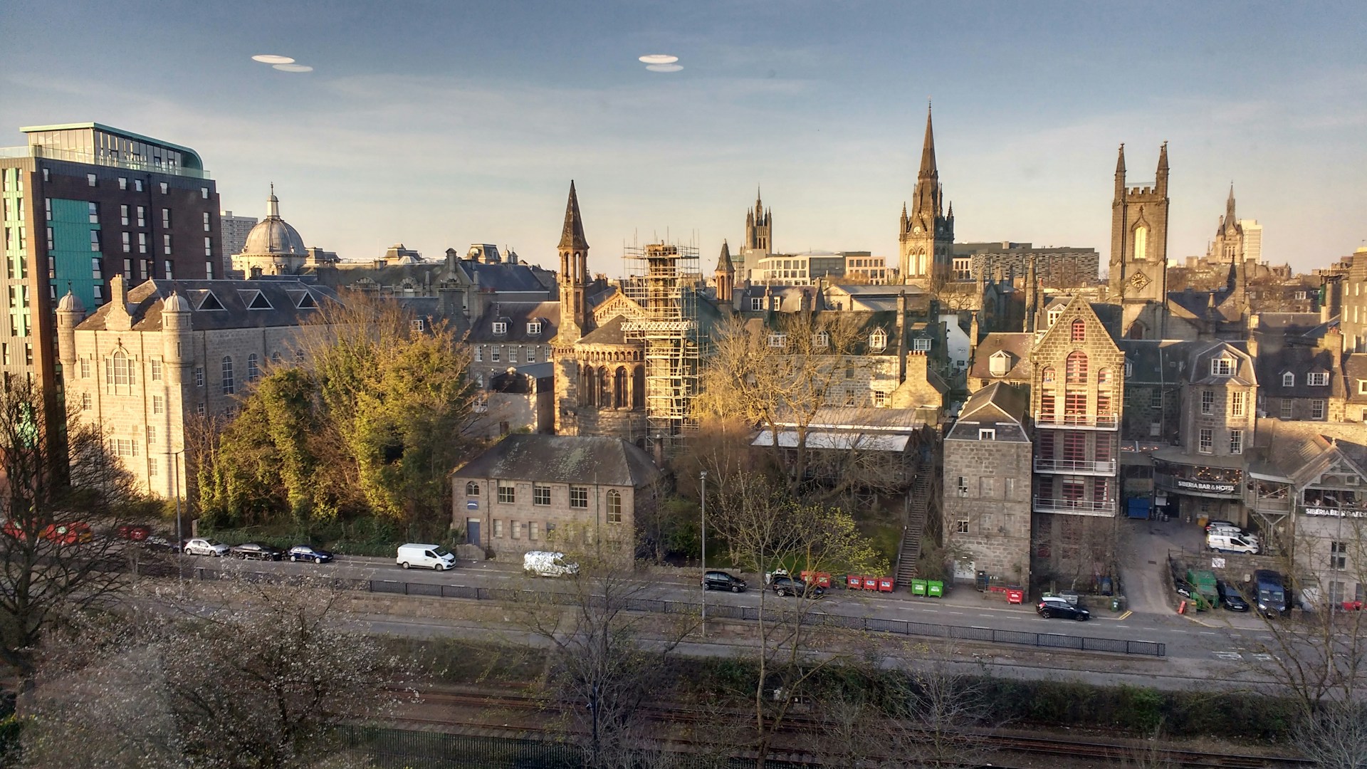 Aberdeen's granite skyline and church spires above the railway, a city J Mould covers for demolition