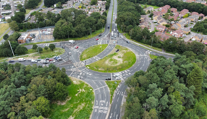Aerial view of a Bracknell roundabout signed for the A329(M), M4, A3095 and A322, an area J Mould covers