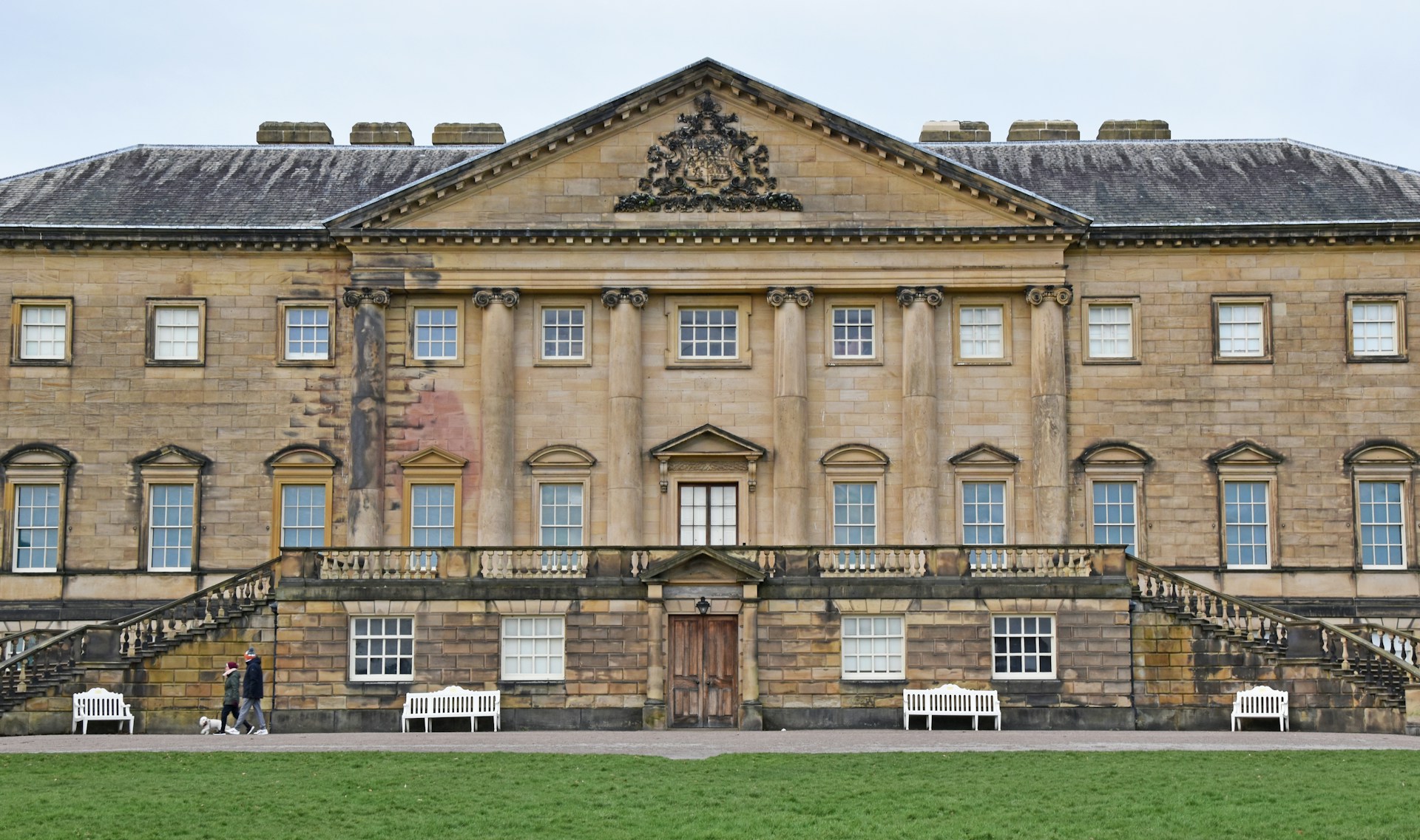 Georgian stone country house with a pedimented centre and twin stairs, an area J Mould covers for demolition