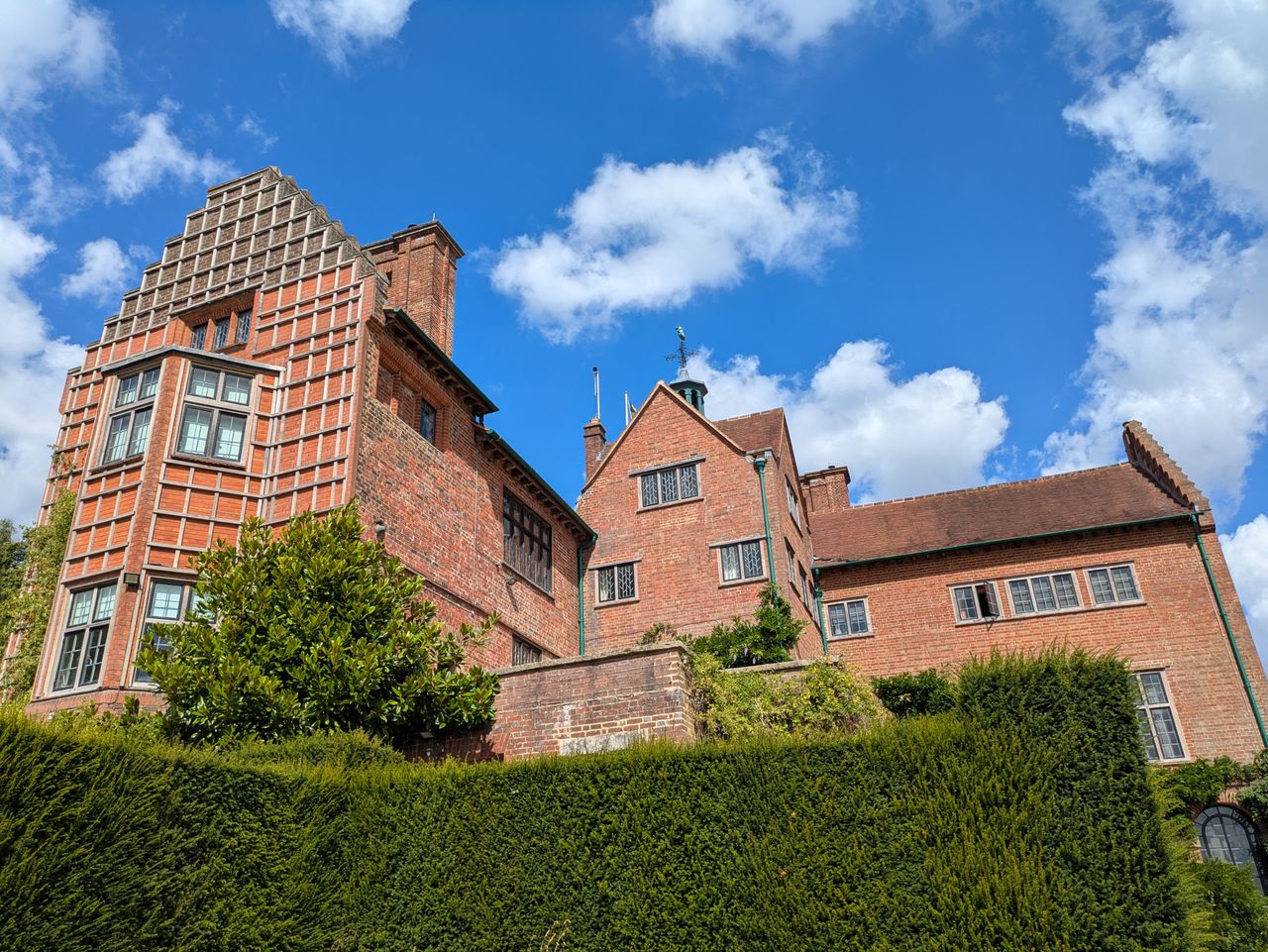 Red-brick country house with a stepped gable and leaded windows in Crowthorne, where J Mould delivers skips