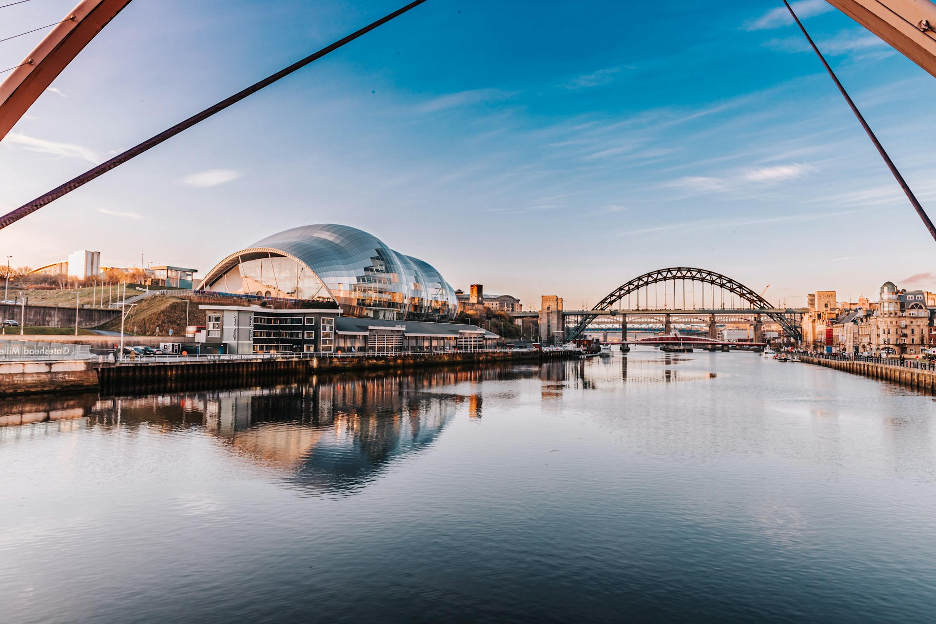 The Tyne Bridge and the Sage reflected in the River Tyne at Newcastle, served by J Mould demolition